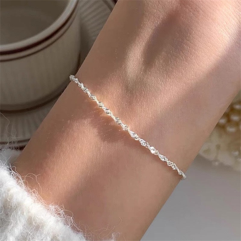 Versatile elegant women's gold twisted chain bracelet, a stylish fashion accessory for day or night.