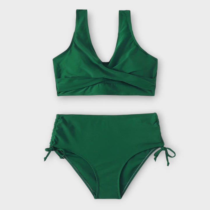Black figure-flattering women's bikini. Stylish two-piece swimwear, ideal for curvy body types, beach & poolside fashion.