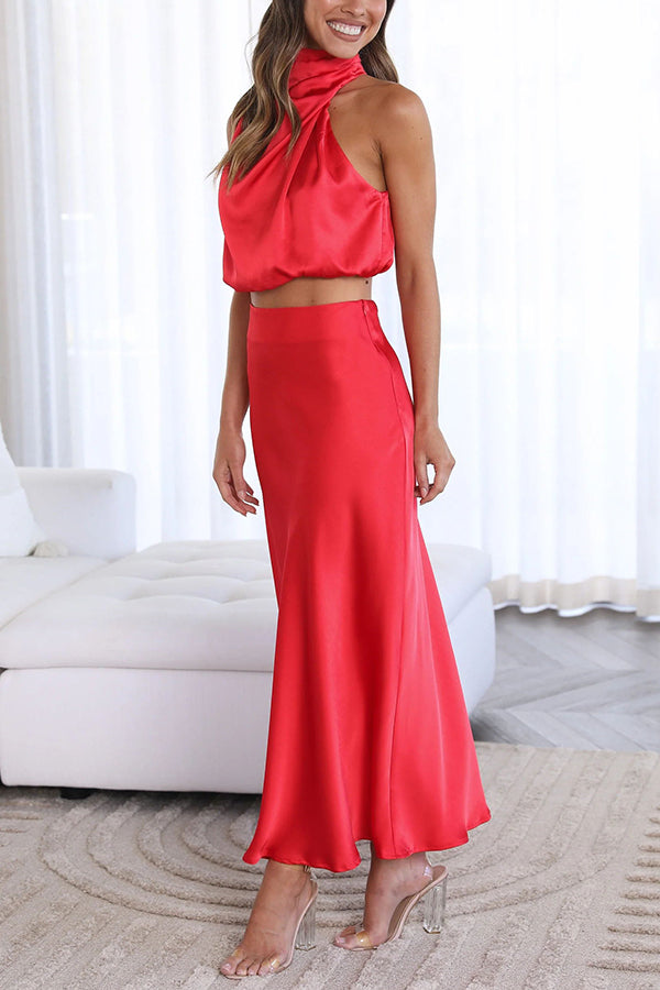 Women's special occasion outfit: a stylish halter crop top & long draped maxi skirt.