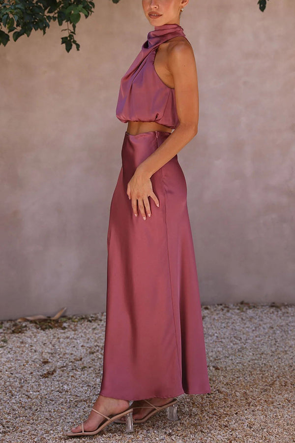 Women's party-ready two-piece set featuring a halter crop top & a draped maxi skirt.