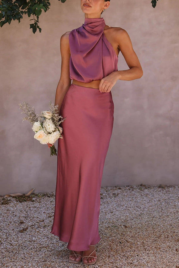 Elegant women's coordinated outfit: halter crop top & flowing maxi skirt for formal wear.