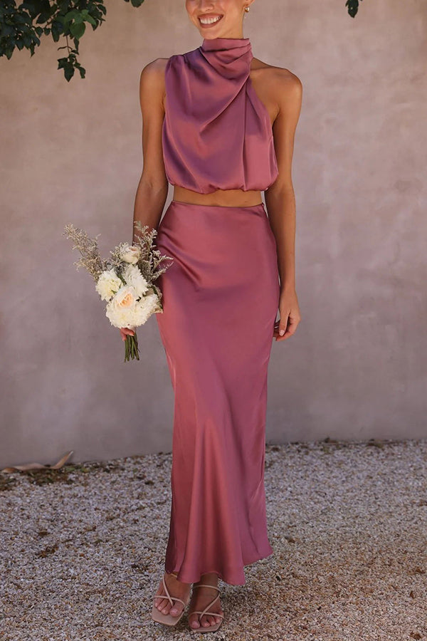 Sophisticated women's special occasion halter crop top & draped maxi skirt ensemble.