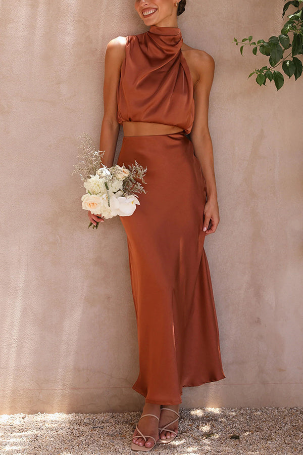 Women's chic spring/summer two-piece: halter crop top & elegant flowing maxi skirt.