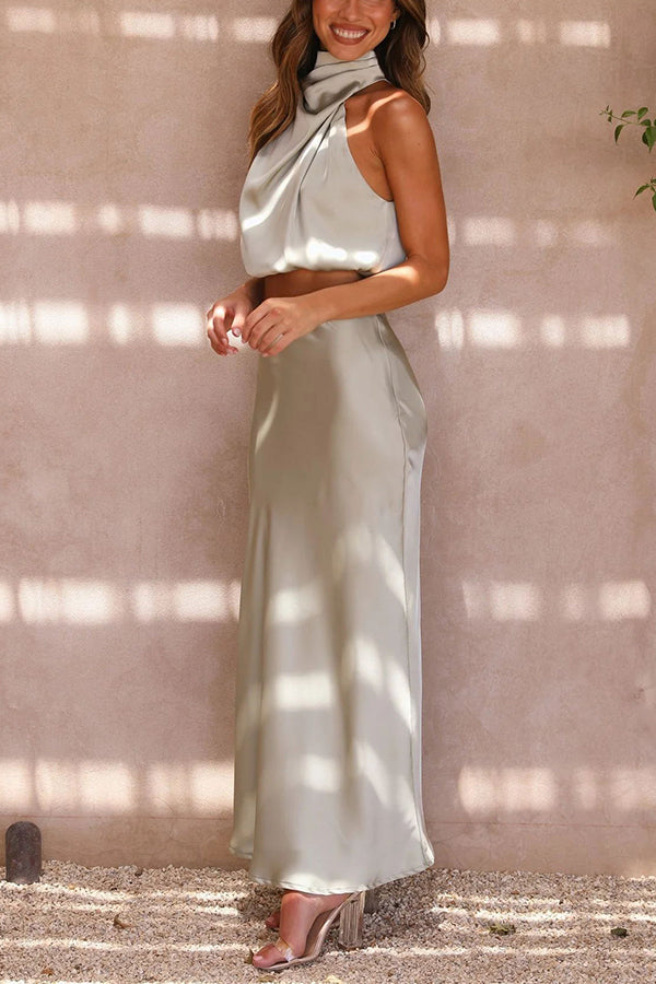 Stylish women's spring/summer party wear: halter crop top & high-waisted maxi skirt set.