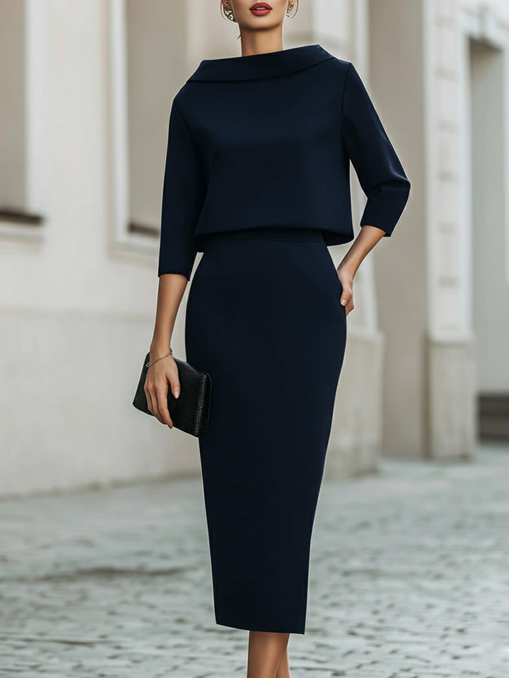 Chic women's boat-neck top and midi skirt matching set. Ideal for office or stylish casual wear.