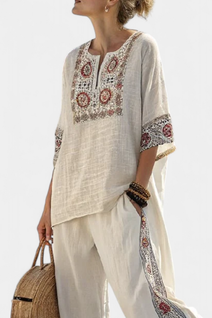 Relaxed fit women's set with a beautifully embroidered blouse and comfortable wide trousers for a chic, versatile look.