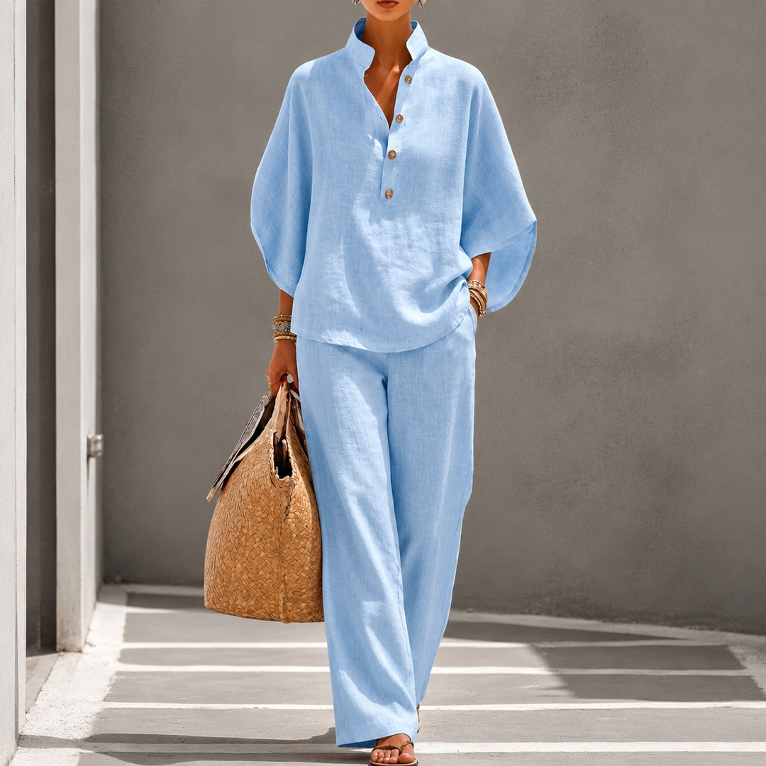 Elegant women's two-piece set featuring a relaxed blouse & wide-leg pants for a sophisticated casual look.