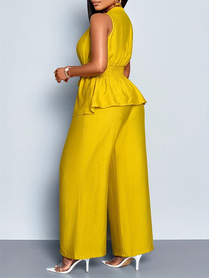 Stylish tailored women's outfit: V-neck wrap top & comfortable wide-leg trousers. Ideal matching fashion set.
