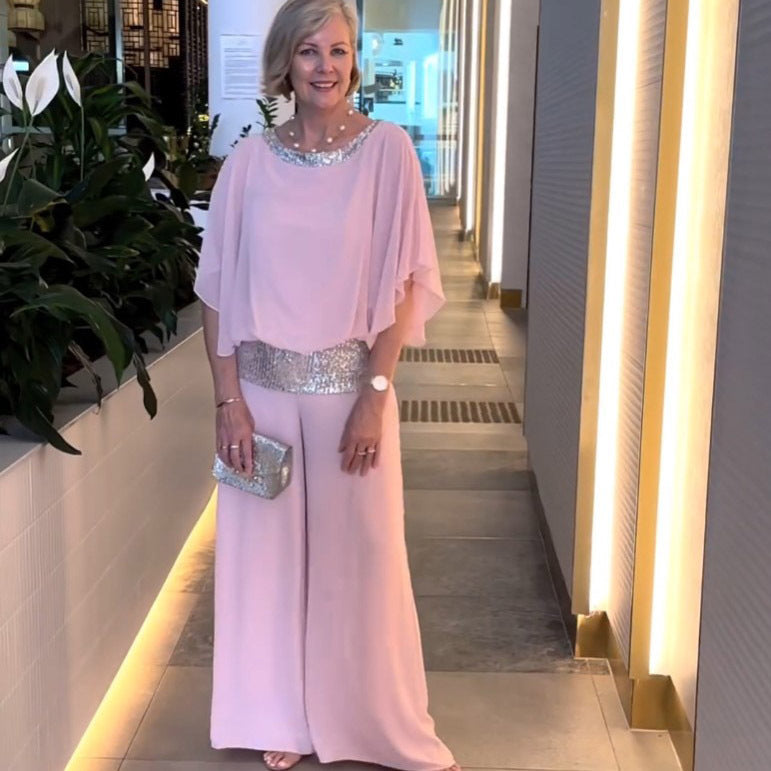 Elegant women's two-piece set with a flowing wide-sleeve top and comfortable wide-leg pants. Ideal for formal wear.