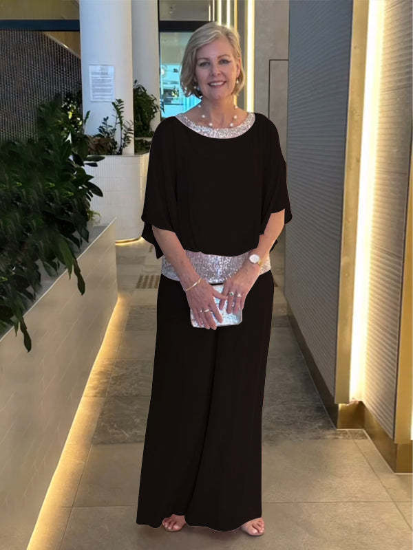 Sophisticated women's wide sleeve top & wide leg pant set. A comfortable and stylish outfit for evening attire.