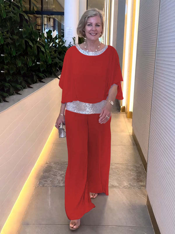 Graceful women's wide sleeve top and wide leg pant set. Perfect elegant evening attire for a sophisticated woman.