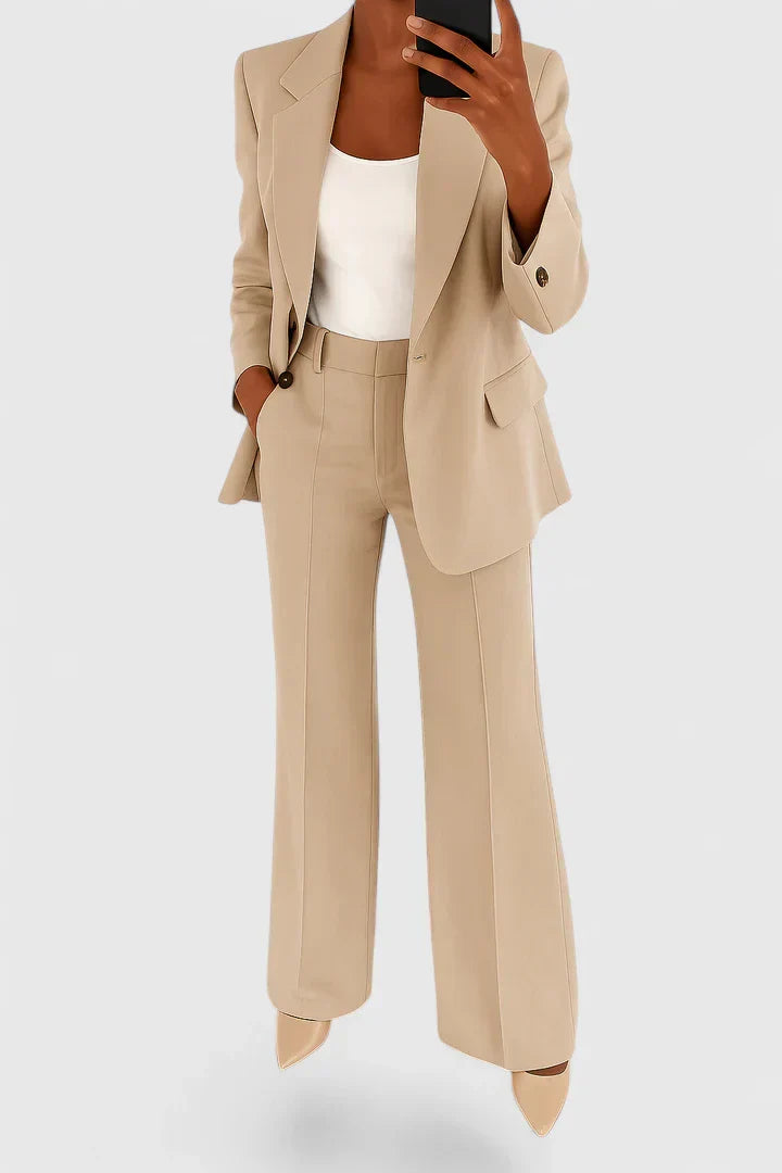 Woman in elegant two-piece suit set, ideal for office wear, business meetings, and formal events. Classic style.