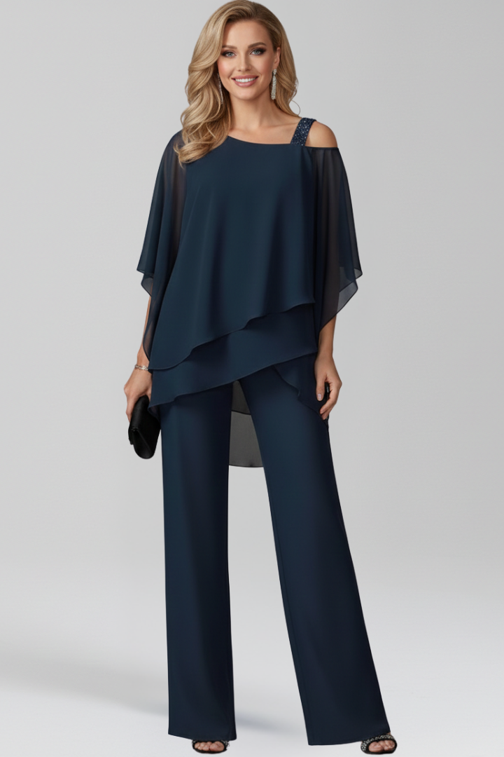 Elegant women's two-piece trouser set with modern asymmetrical top & straight leg pants, perfect for evening events.