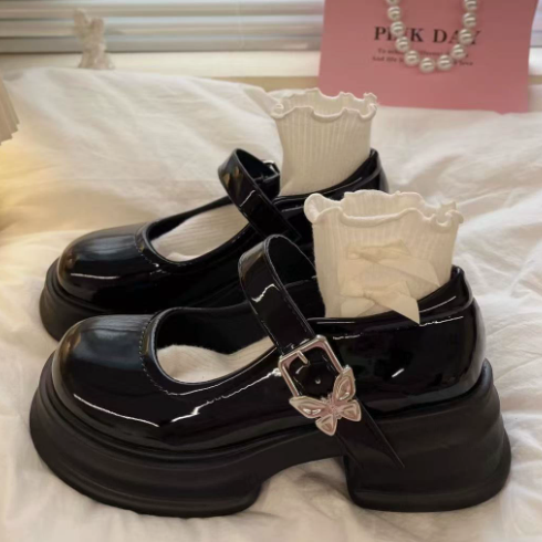 Elegant women's two-tone Mary Jane shoes with a comfortable block heel and classic strap; perfect for ladies.