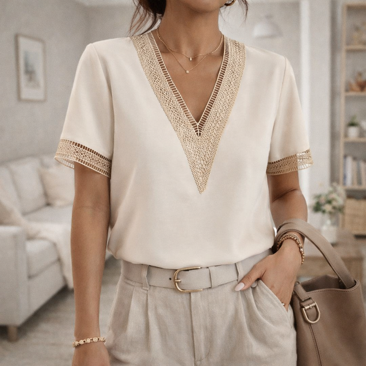 Elegant women's V-neck blouse with delicate lace trim & short sleeves. Perfect for sophisticated spring & summer fashion.