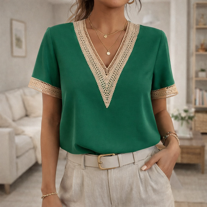 Versatile women's V-neck short sleeve blouse with beautiful lace trim. Ideal for office wear or casual weekend style.