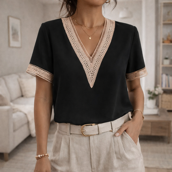 Stylish V-neck lace trim short sleeve top for women. A relaxed fit blouse perfect for elegant summer fashion.