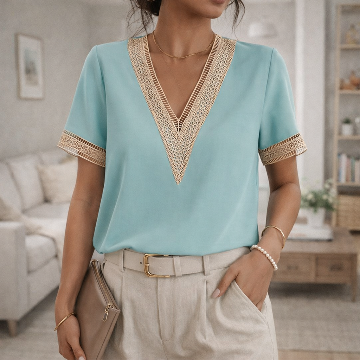 Casual yet elegant women's short sleeve V-neck blouse with delicate lace trim, great for spring comfort.