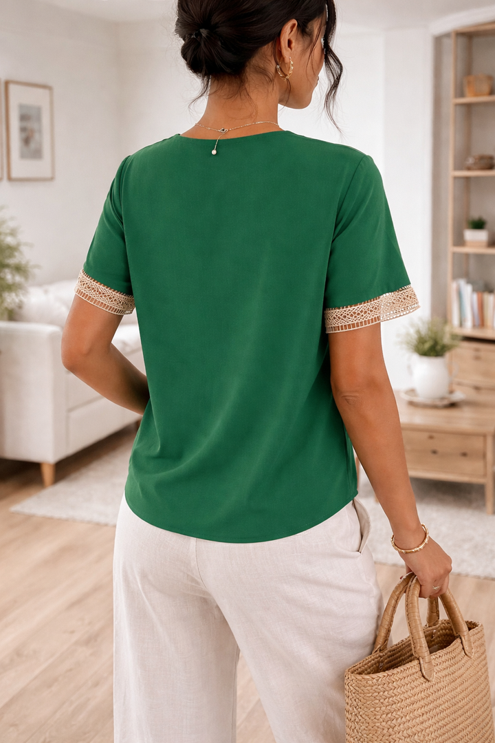 Chic women's V-neck blouse, featuring delicate lace trim and short sleeves. An elegant and versatile spring top.
