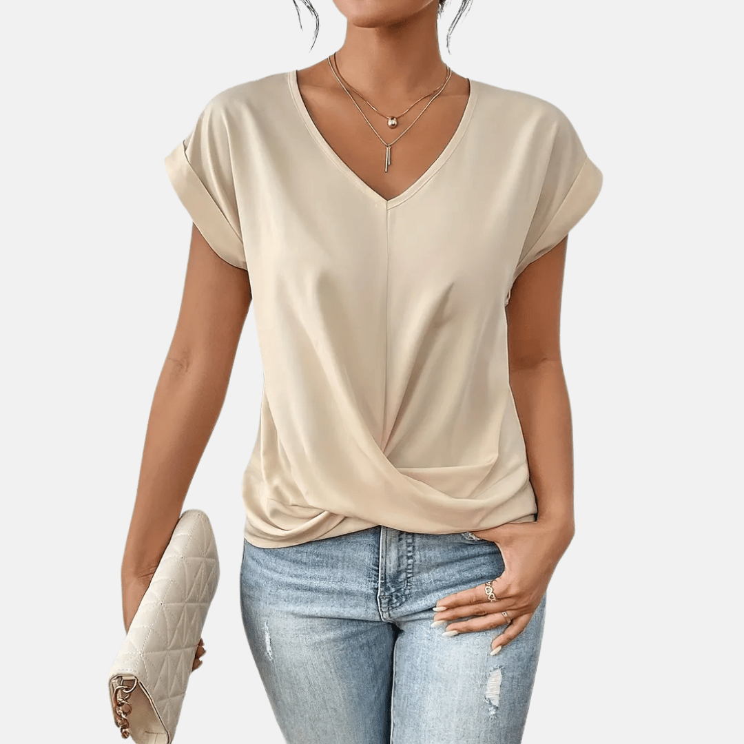 Elegant women's V-neck blouse with draped hem. Perfect for spring & summer. Comfortable short sleeve top.