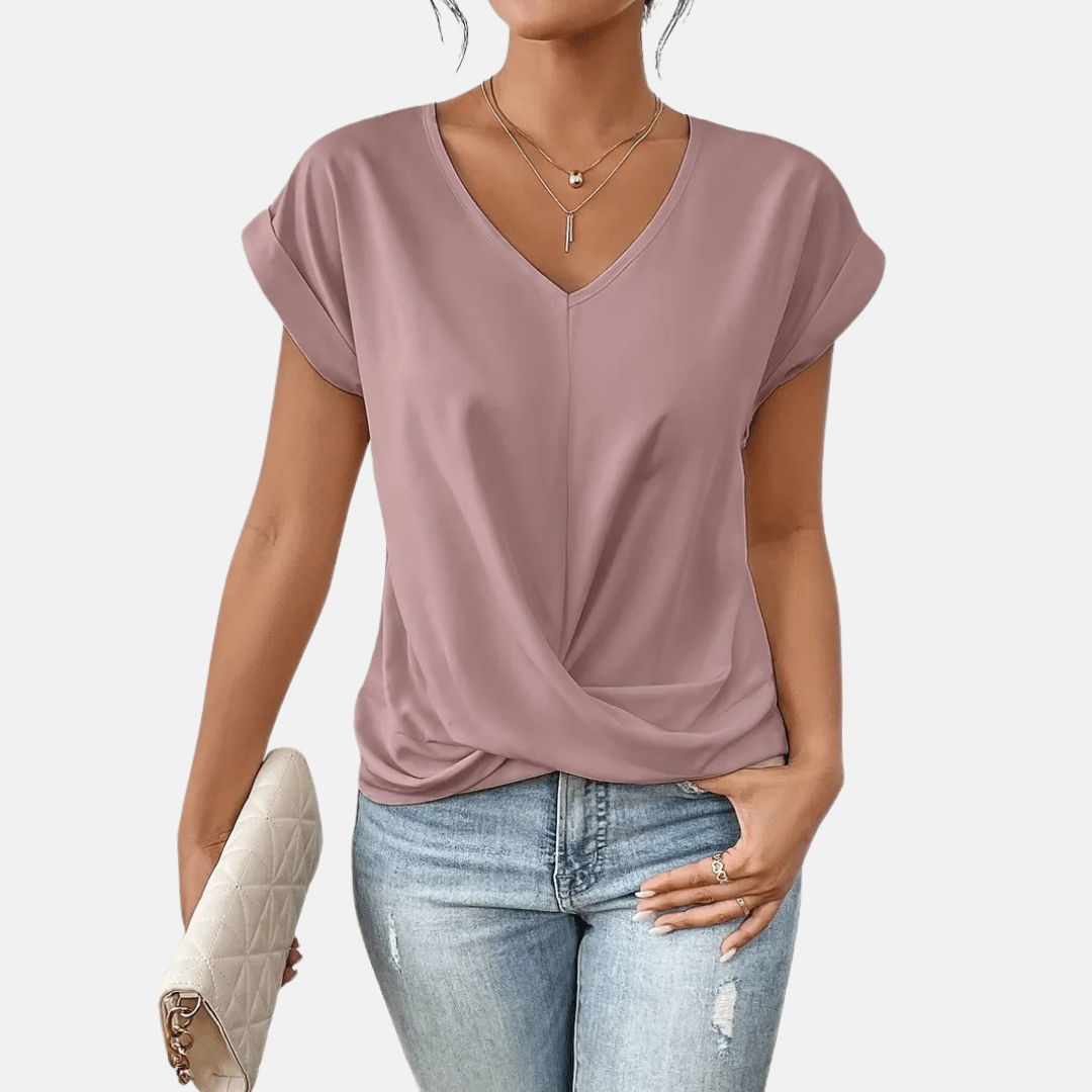 Women's elegant V-neck blouse, a short sleeve summer top with a graceful draped hem. Versatile everyday wear.