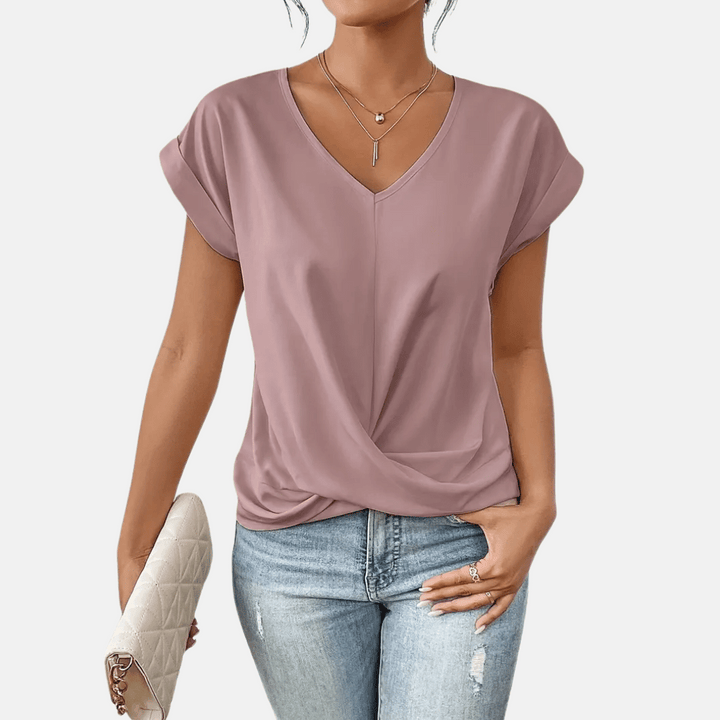 Women's elegant V-neck blouse, a short sleeve summer top with a graceful draped hem. Versatile everyday wear.