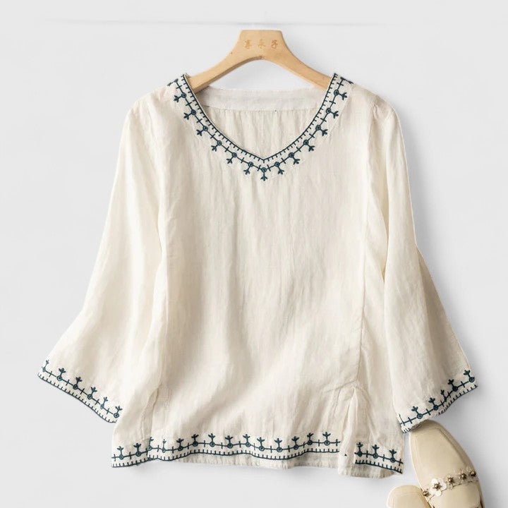 Comfortable women's embroidered V-neck blouse, ideal for versatile spring and summer outfits.
