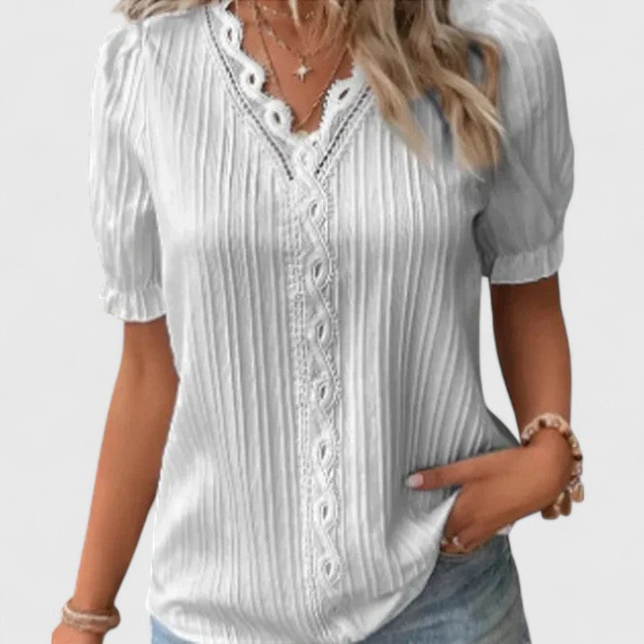 Chic women's short sleeve V-neck top, perfect for summer. Features elegant hollow sleeves and a comfortable fit.