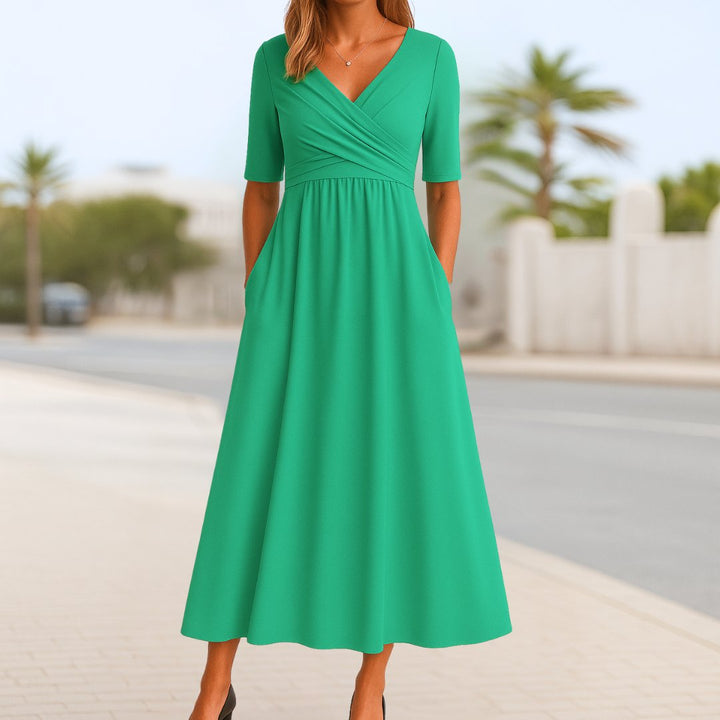 Versatile women's casual or workwear midi dress with a V-neck, short sleeves, and cross-front.