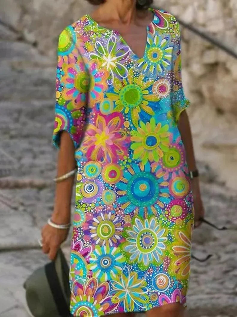 Elegant women's V-neck floral midi dress with short sleeves, perfect for summer & spring style.