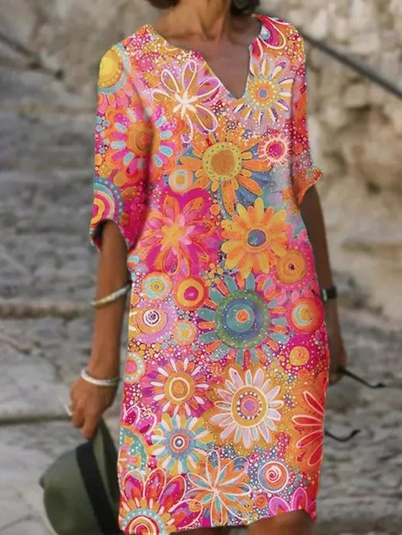 Chic women's short-sleeve V-neck midi dress featuring a beautiful floral print. Ideal for spring fashion.
