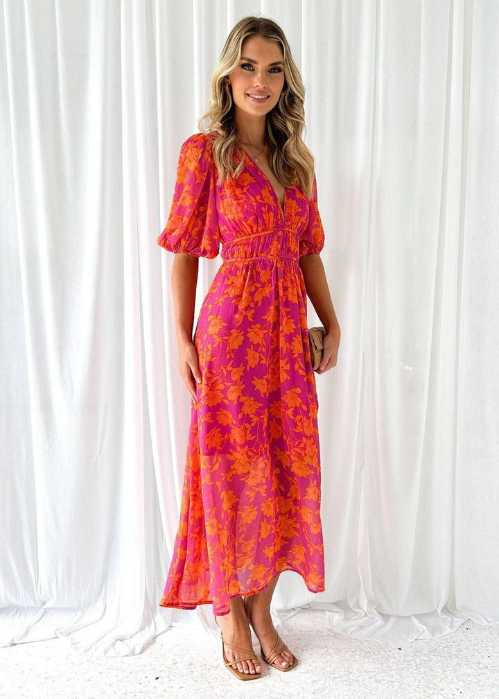Chic floral print midi dress for women, featuring puff sleeves & a flattering V-neck, ideal for spring fashion.