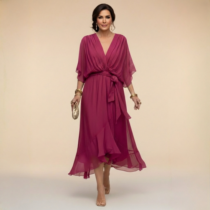 Women's elegant V-neck maxi dress featuring graceful flowy sleeves. Perfect for sophisticated evening & party wear.