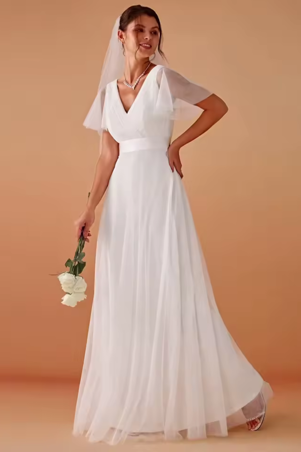 Chic long A-line wedding guest dress with flattering V-neckline and delicate flutter sleeves.