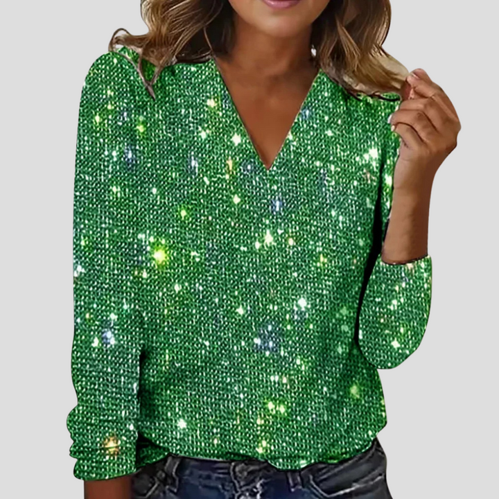 Festive women's long sleeve glitter top with V-neck, an elegant shimmering blouse for evening wear.