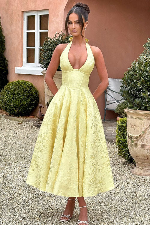 Sophisticated V-neck halter maxi dress, jacquard fabric, ideal for women's parties.