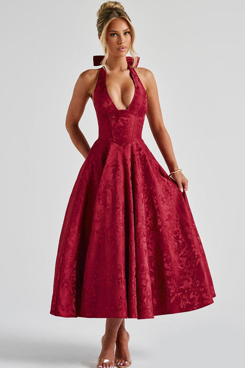 Open back V-neck halter maxi dress, luxurious jacquard pattern, evening wear.