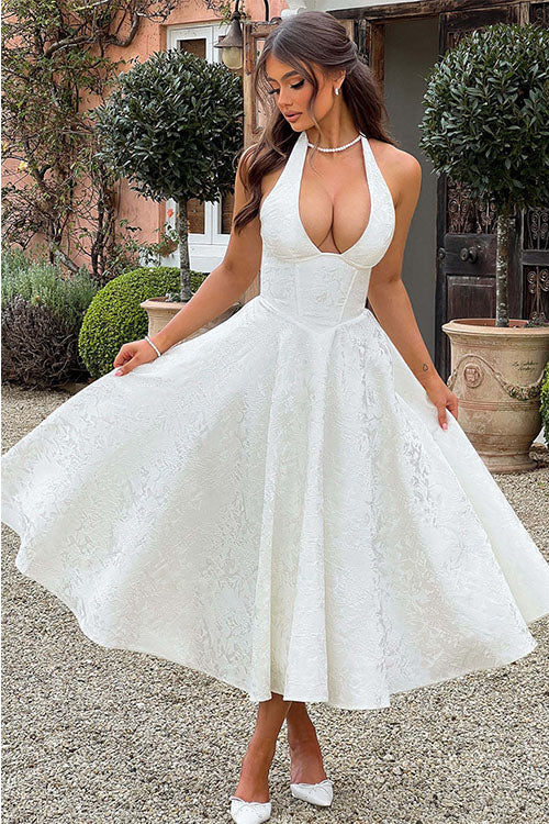 Sophisticated women's evening gown, V-neck halter, detailed jacquard pattern.
