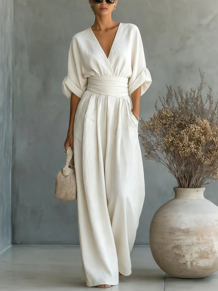 Chic V-neck jumpsuit for women, ideal for professional workwear or smart casual office looks. Tailored elegance.