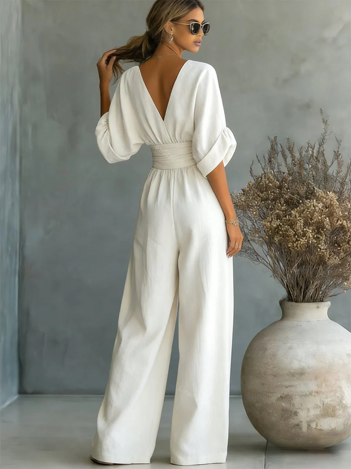 Sophisticated women's V-neck one-piece jumpsuit, perfect for elegant evening wear & special occasions. Chic fashion.