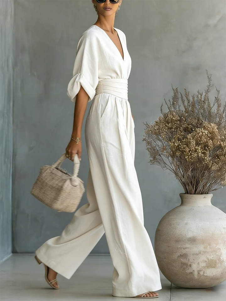 Flattering women's V-neck jumpsuit, a tailored one-piece for a chic, elegant work or weekend outfit. Versatile style.