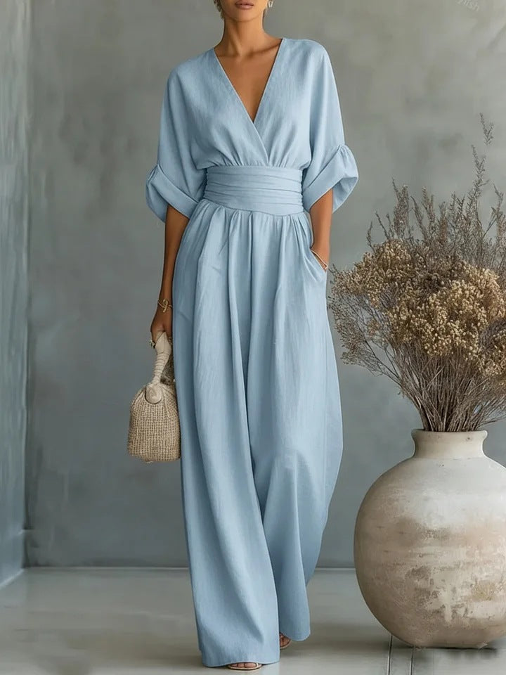 Stylish V-neck women's jumpsuit, offering elegant workwear and sophisticated smart casual fashion. One-piece outfit.