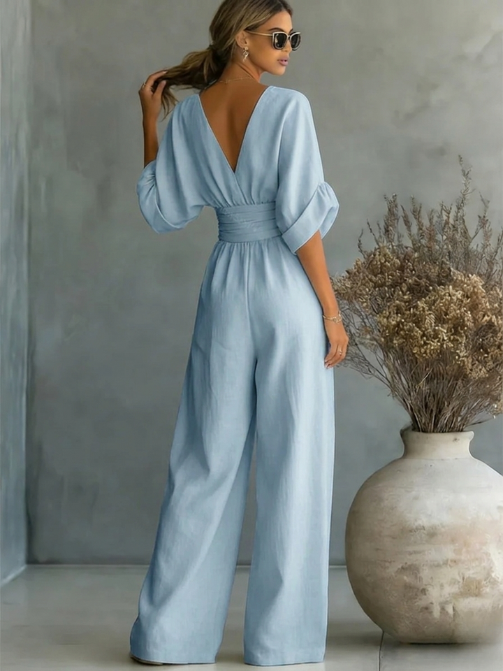 Modern women's elegant V-neck jumpsuit, a versatile one-piece for effortless work and weekend fashion. Chic & flattering.