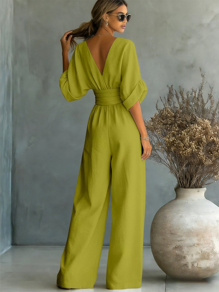 Chic V-neck women's jumpsuit for elegant workwear, evening events, and flattering smart casual fashion. Versatile one-piece.