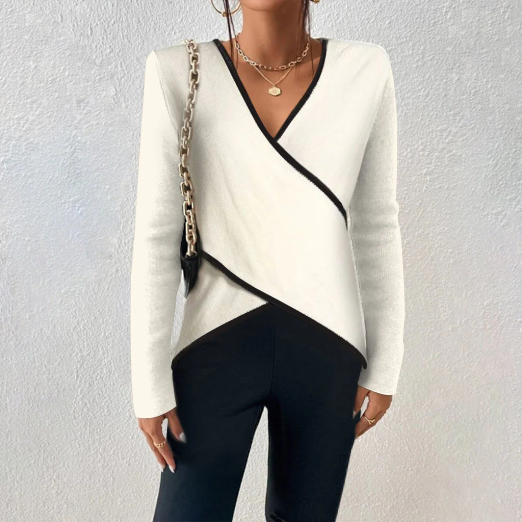 Elegant women's V-neck knit sweater in a neutral tone, perfect for versatile layering in fall and winter fashion.