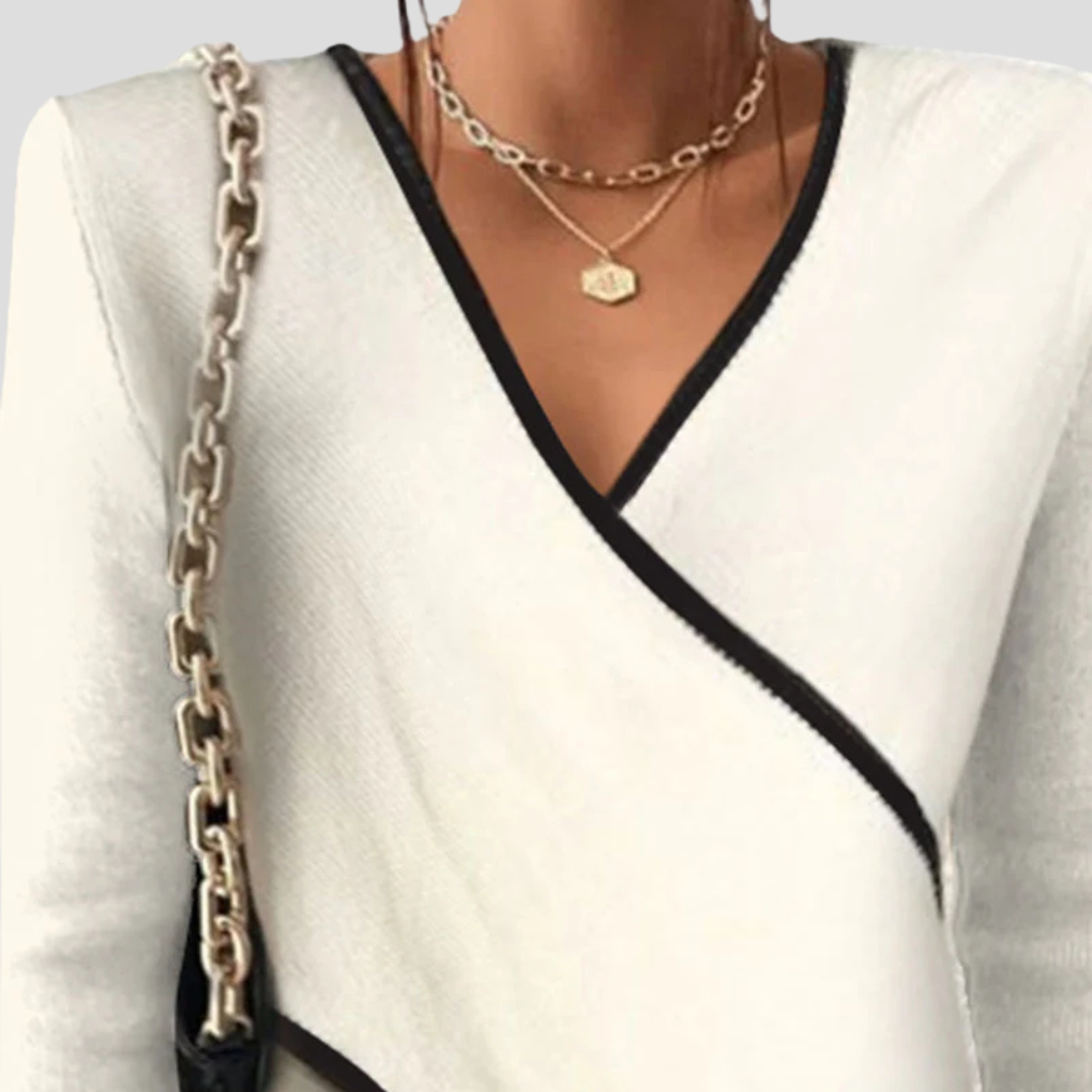 Stylish women's long sleeve V-neck sweater, comfortable knit for casual wear or elegant fall outfits.