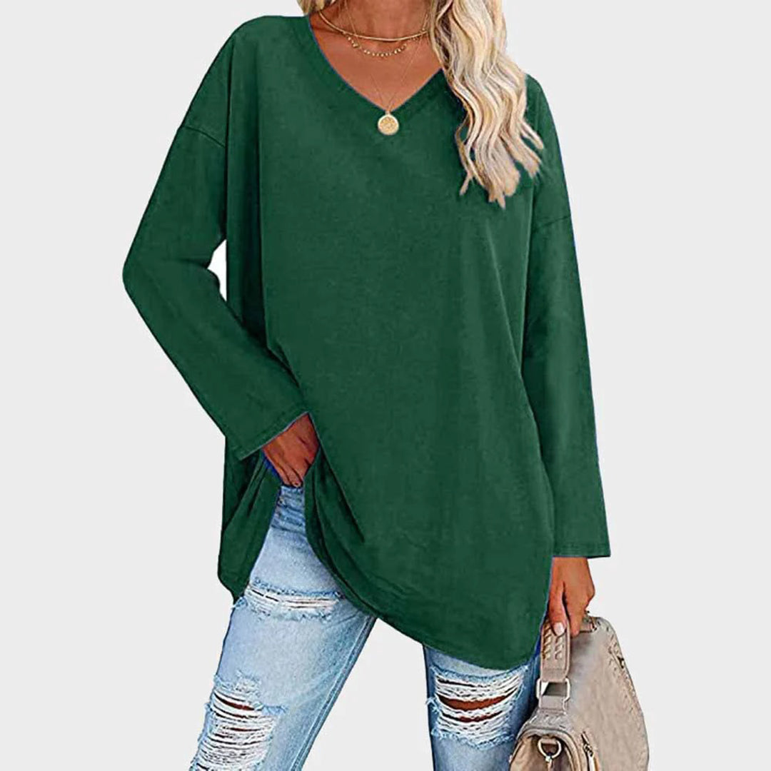 Women's elegant V-neck long sleeve top. Perfect for versatile formal or stylish casual outfits.