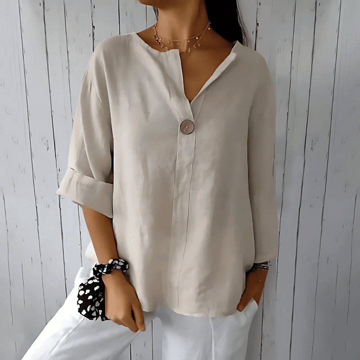 Fashionable women's loose V-neck blouse, ideal summer top with 3/4 sleeves for comfort & office chic. Plus size available.