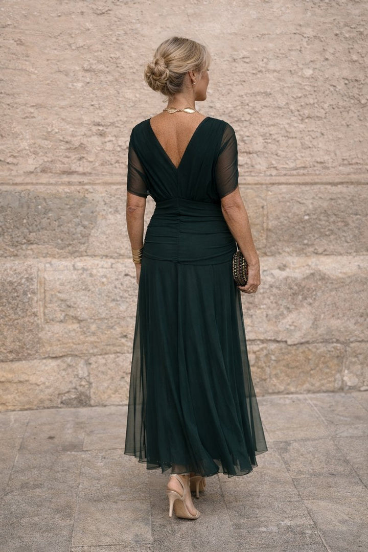 Women's elegant V-neck cocktail party dress with a stylish pleated waist, ideal for special occasions.