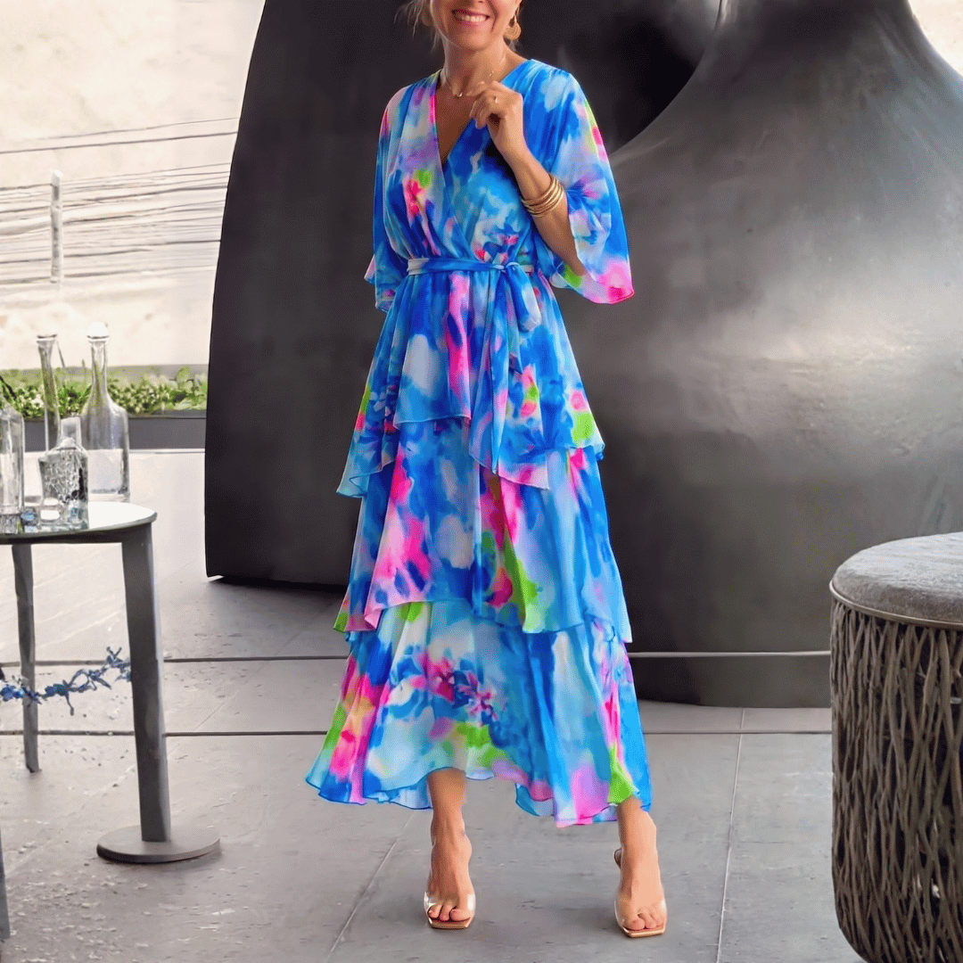 Elegant women's V-neck midi dress, perfect for cocktail parties & special occasions. Features a stylish blue print.